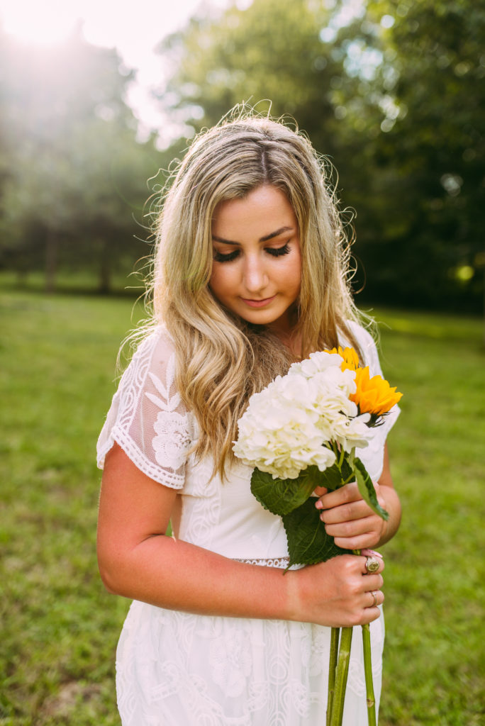 Flowers make beautiful props for senior photos